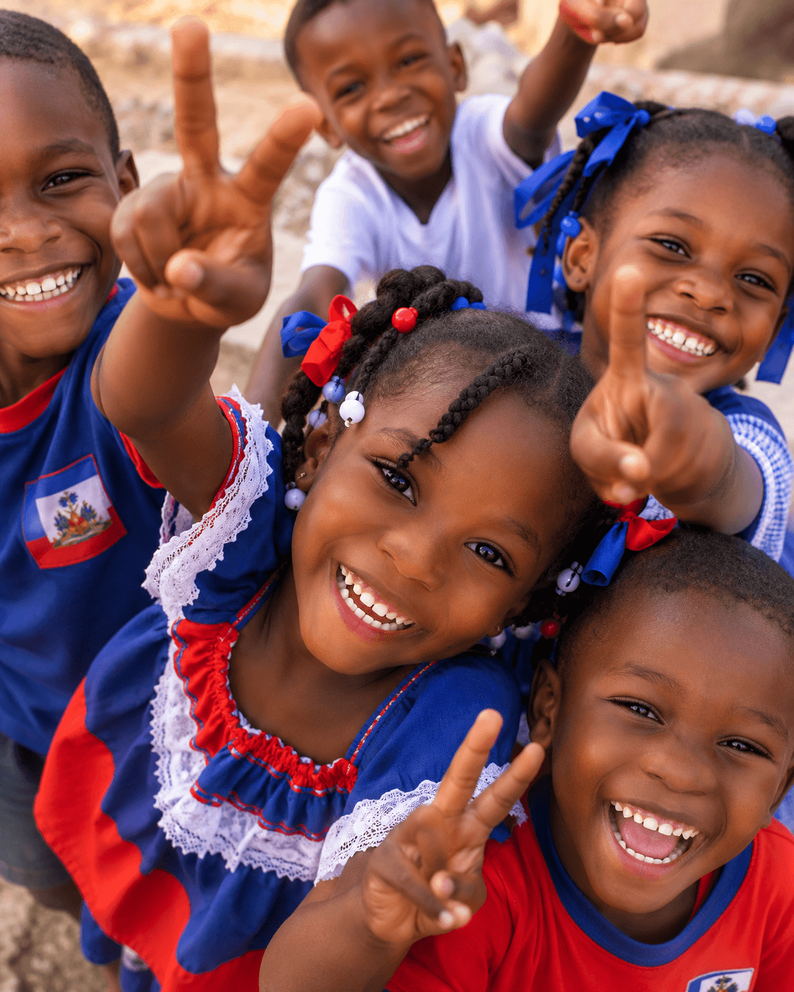 Children in Haiti smiling and celebrating community